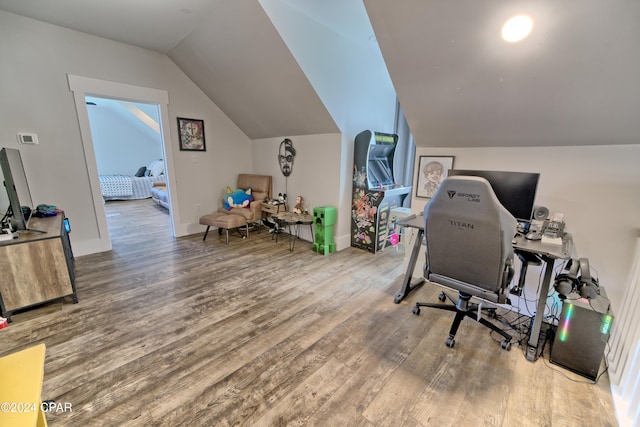 office featuring wood-type flooring and lofted ceiling