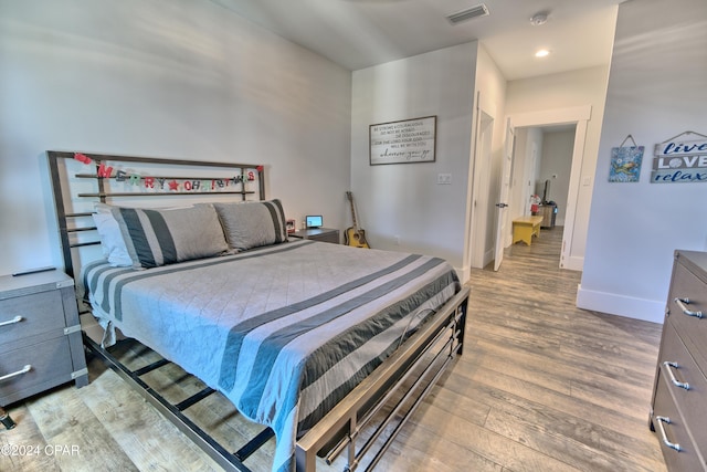 bedroom featuring hardwood / wood-style flooring