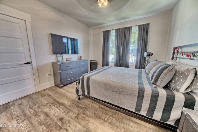 bedroom featuring ceiling fan and light hardwood / wood-style floors