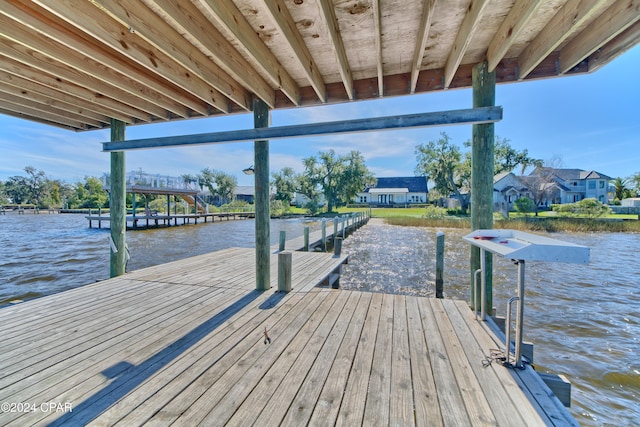 dock area featuring a water view