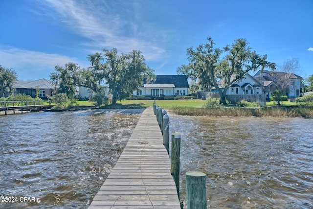 dock area featuring a water view