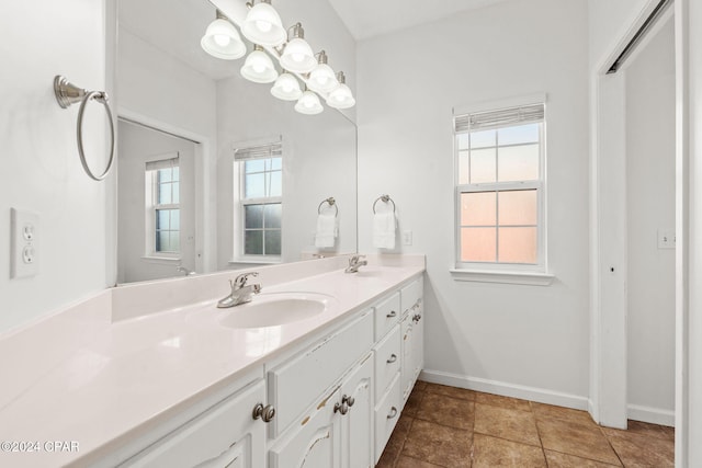 bathroom featuring tile patterned floors, plenty of natural light, and vanity