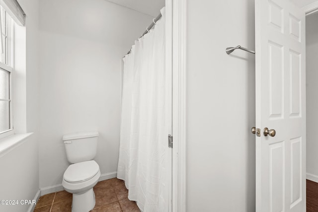 bathroom with tile patterned floors and toilet