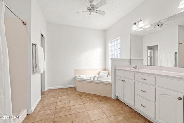 2405 Camryns Xing, Panama City, FL 32405 - bathroom featuring ceiling fan, a textured ceiling, vanity, and a garden tub