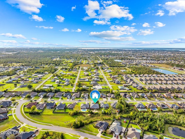 drone / aerial view with a water view