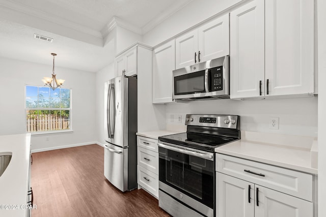 kitchen with white cabinetry, dark wood-type flooring, a chandelier, decorative light fixtures, and appliances with stainless steel finishes