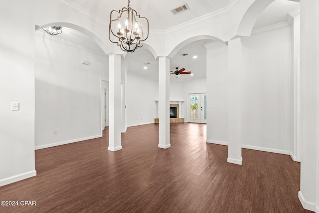 2405 Camryns Xing, Panama City, FL 32405 - unfurnished living room featuring ceiling fan with notable chandelier, dark wood-style flooring, ornamental molding, and visible vents