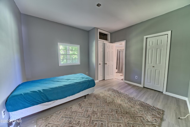 bedroom with light hardwood / wood-style flooring