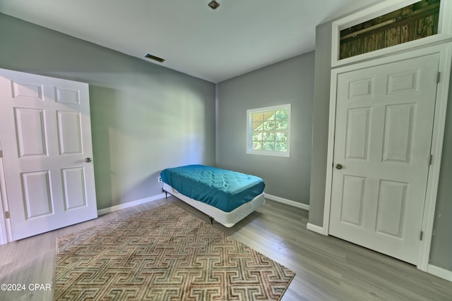 bedroom with light hardwood / wood-style floors