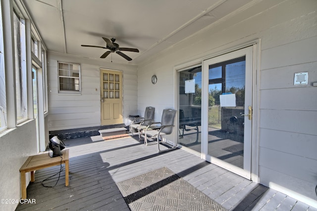 sunroom / solarium with ceiling fan