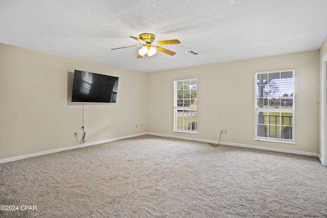 18496 NE Live Oak Ln, Blountstown, FL 32424 - carpeted spare room with plenty of natural light, visible vents, a ceiling fan, and baseboards