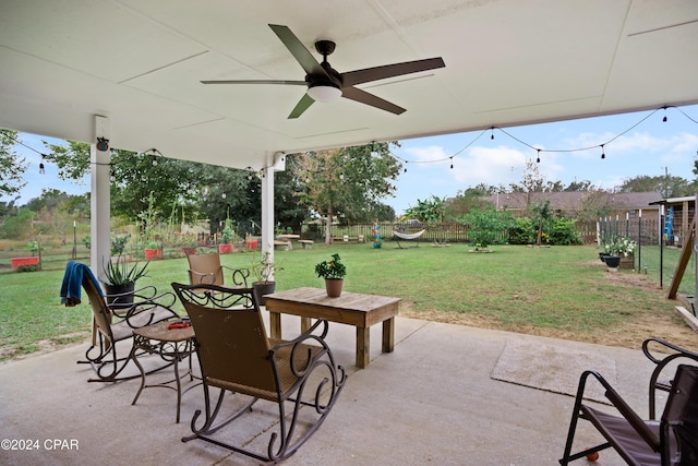 18496 NE Live Oak Ln, Blountstown, FL 32424 - view of patio / terrace featuring a fenced backyard, a ceiling fan, and outdoor dining space