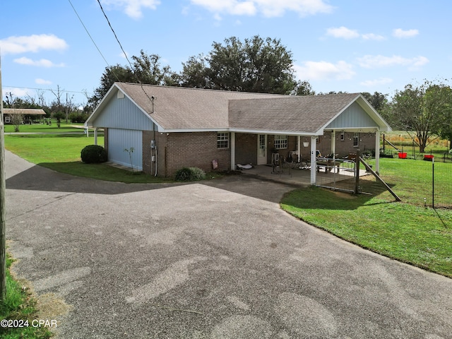 ranch-style home with a patio area and a front yard