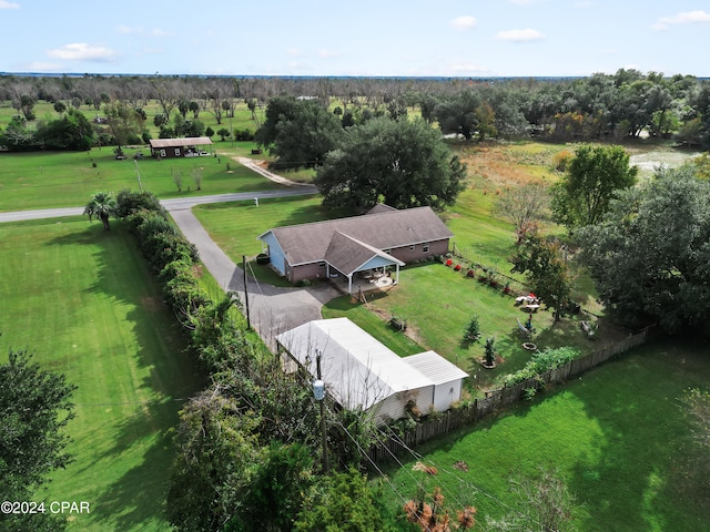 birds eye view of property with a rural view