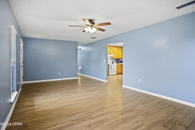 18496 NE Live Oak Ln, Blountstown, FL 32424 - empty room featuring baseboards, a ceiling fan, light wood-style floors, and visible vents