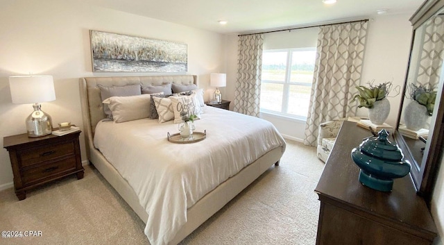 bedroom featuring light carpet