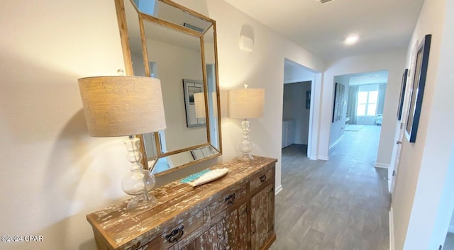 hallway with wood-type flooring