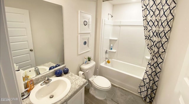 full bathroom with vanity, shower / bath combo, and toilet