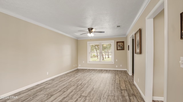 unfurnished room with a textured ceiling, light hardwood / wood-style floors, ceiling fan, and ornamental molding