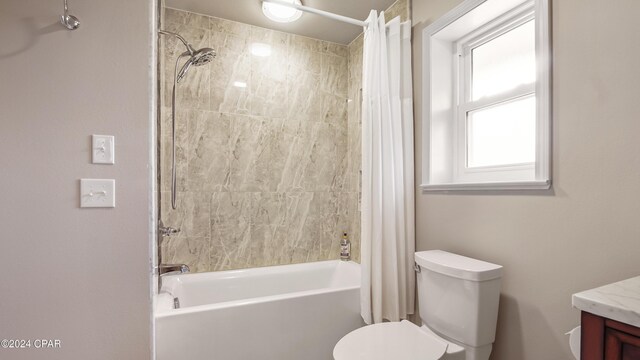 full bathroom featuring vanity, toilet, and shower / bath combo with shower curtain