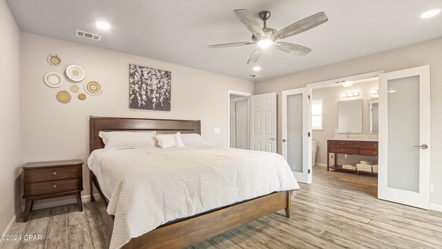 bedroom with access to exterior, ceiling fan, and light hardwood / wood-style flooring