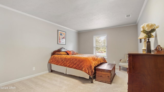 carpeted bedroom with a textured ceiling and ornamental molding