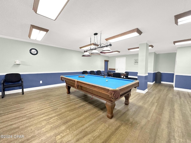 game room featuring wood-type flooring, a textured ceiling, and pool table