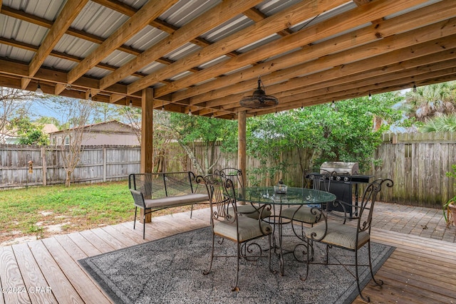 deck featuring ceiling fan and a grill