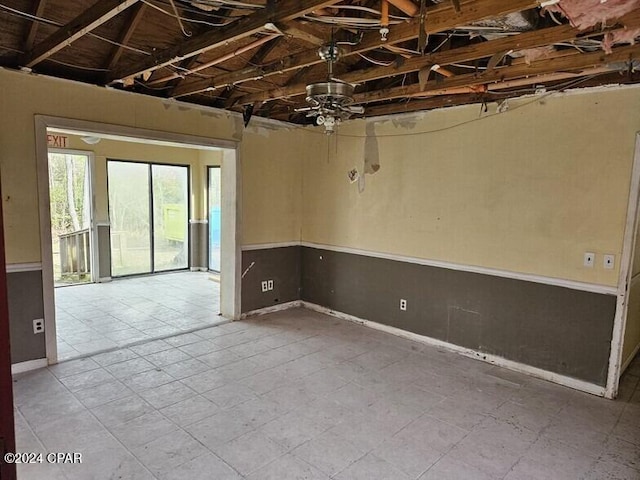 unfurnished room featuring ceiling fan