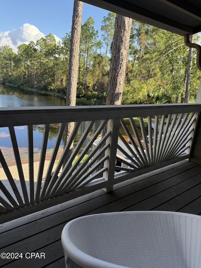 wooden deck featuring a water view