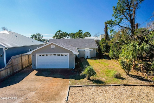 single story home with a garage