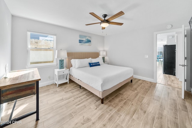 bedroom featuring ceiling fan and light wood-type flooring