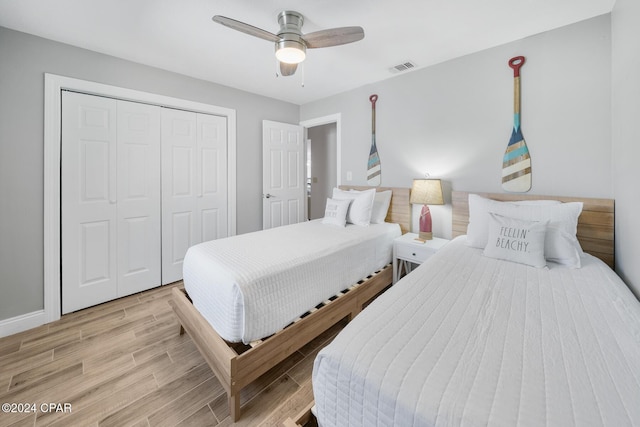 bedroom featuring ceiling fan and a closet