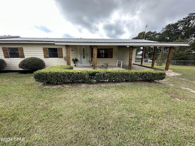 single story home with a front yard and a porch