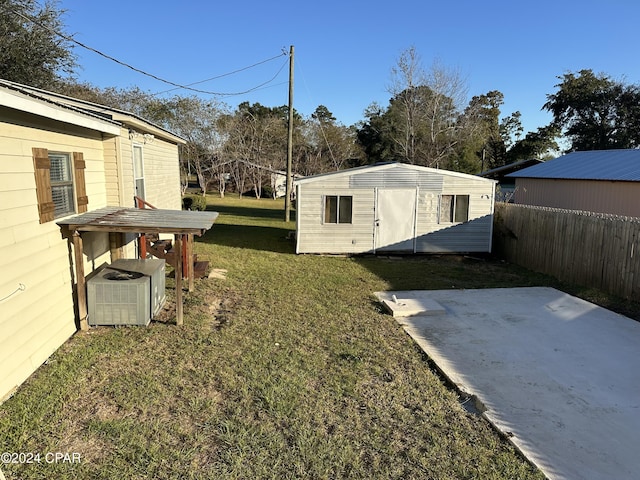 view of yard with a patio area and central air condition unit