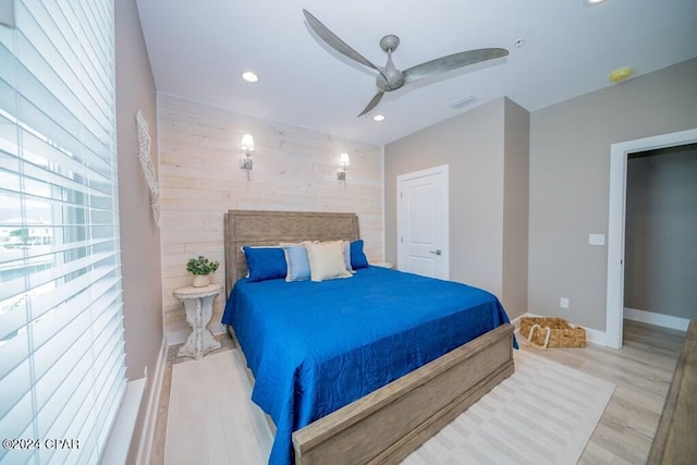 bedroom with ceiling fan and light hardwood / wood-style flooring