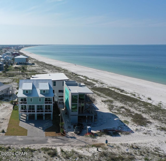 aerial view featuring a view of the beach and a water view