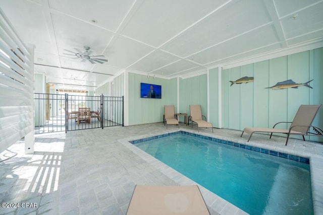 view of swimming pool with a patio area and ceiling fan