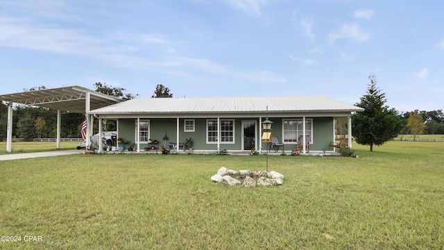 back of house featuring a porch and a yard