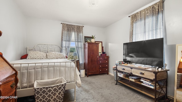 bedroom featuring light colored carpet