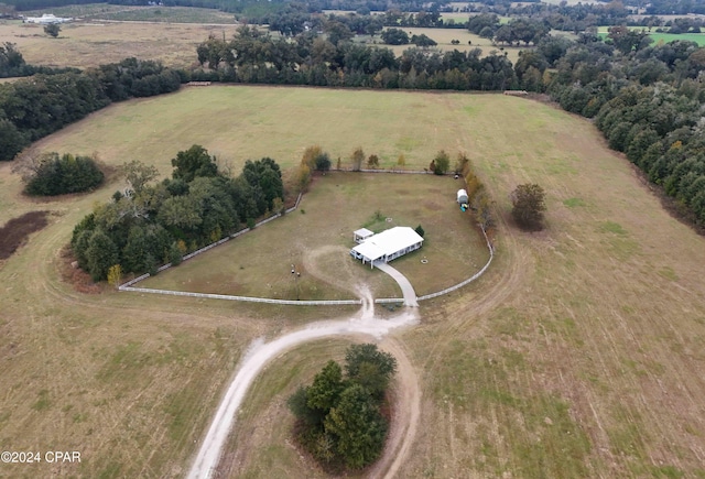 birds eye view of property with a rural view