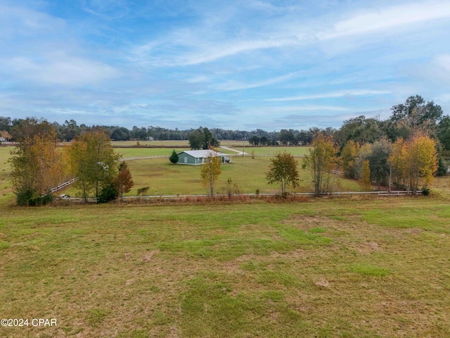 view of yard with a rural view