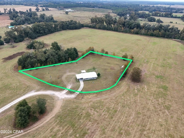 birds eye view of property featuring a rural view