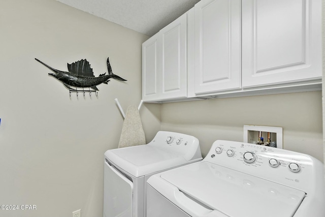 laundry room with cabinet space and washer and dryer