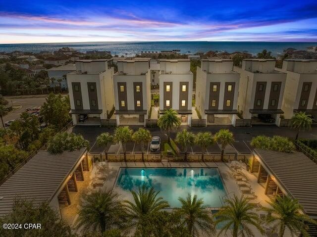 pool at dusk with a water view