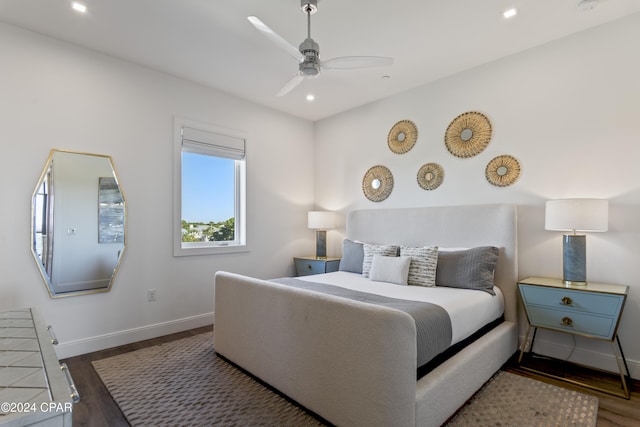 bedroom featuring ceiling fan and dark wood-type flooring