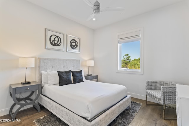 bedroom with ceiling fan and wood-type flooring