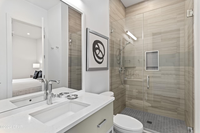 bathroom featuring vanity, toilet, and walk in shower