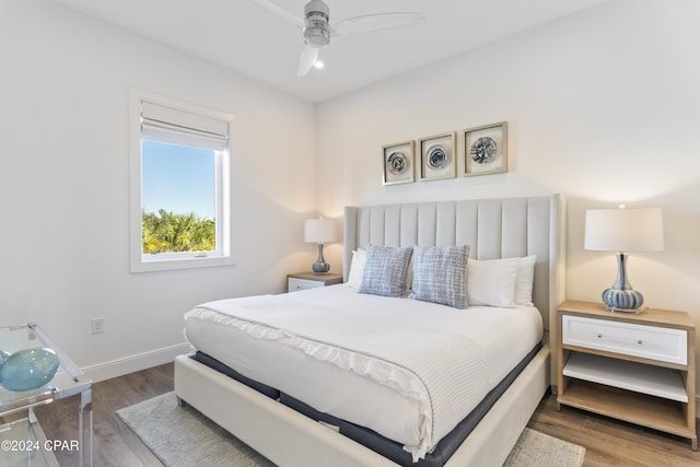 bedroom with hardwood / wood-style flooring and ceiling fan