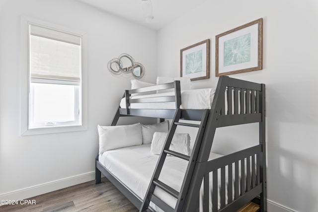 bedroom with hardwood / wood-style flooring